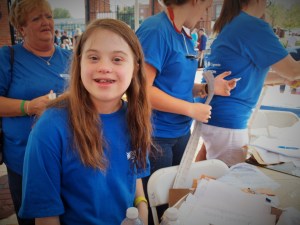 Julia Cirone welcomes participants as they register for the event.