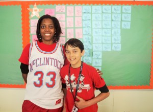 Math Director Dawn Salters stand with one her students, Joel Holder.